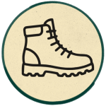 Walking boots icon representing miles walked on the South West Coast Path