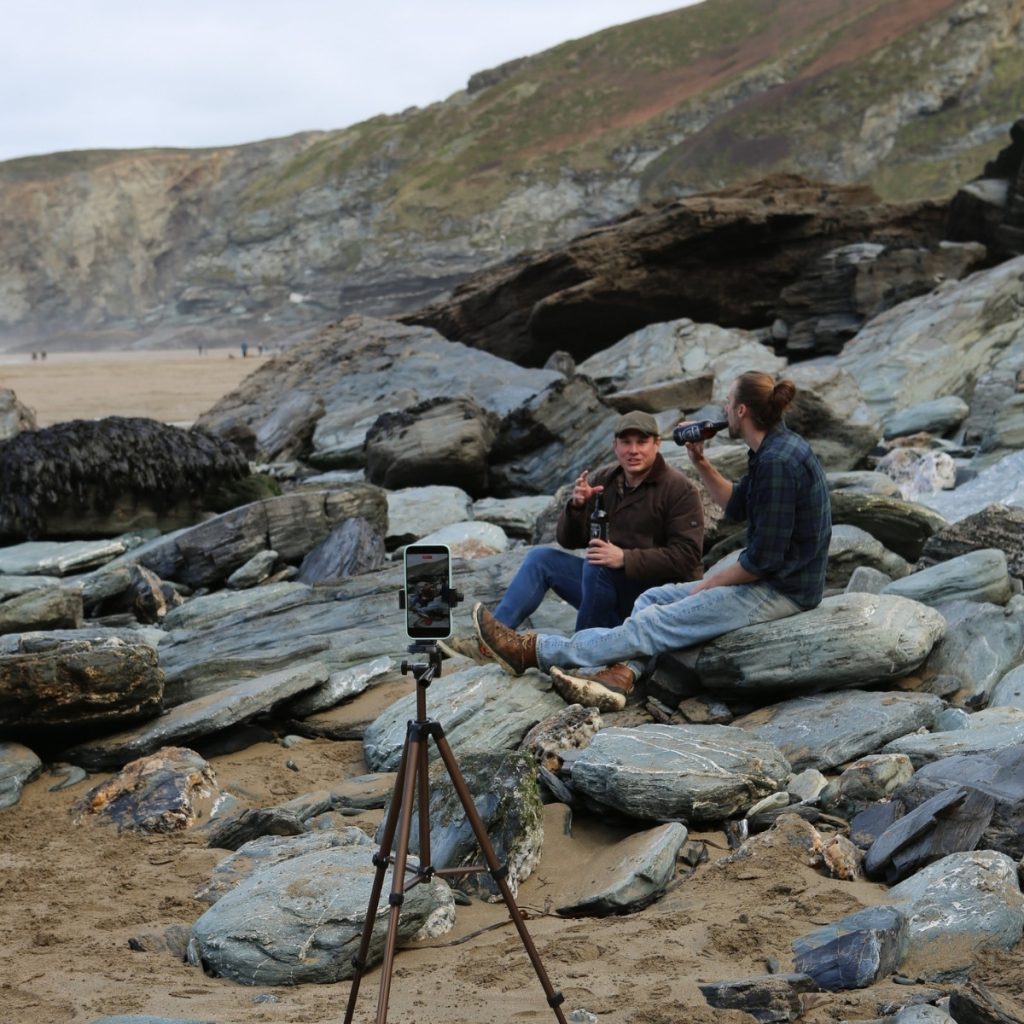 Story led content creation on the Cornwall coast path showing Dan Smedley capturing real moments in the landscape for Bimbling Books and Beer
